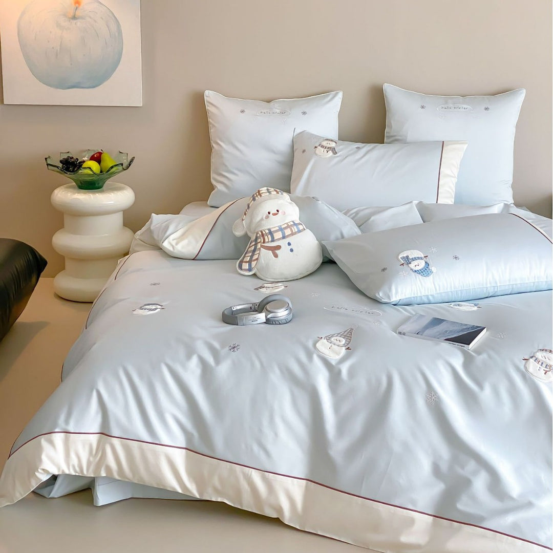 Luxurious bedding set with embroidered snowman appliqués and brushed satin