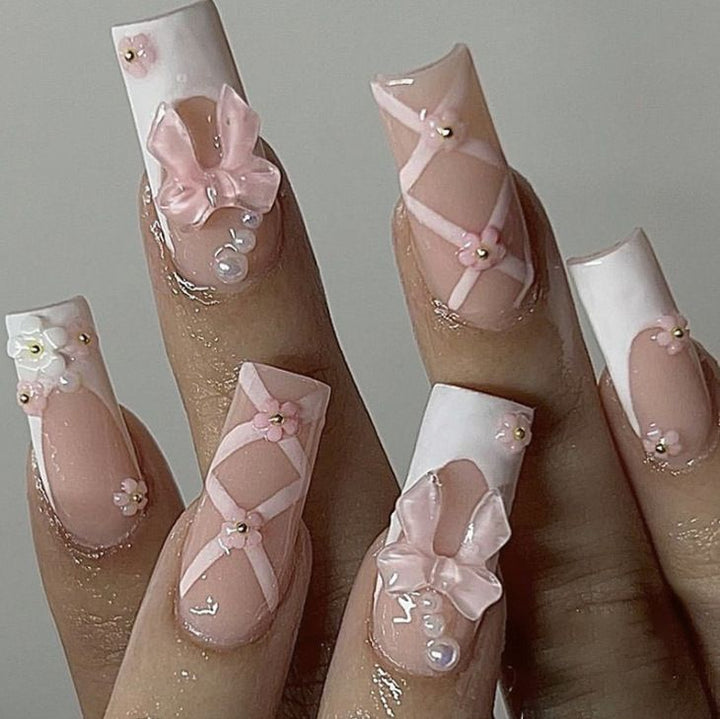 Artistic 3D Nail Tips with Bow Motifs Stornfield