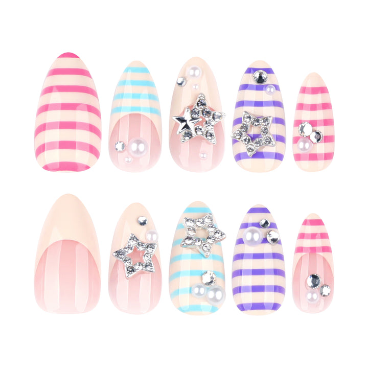 Artistic acrylic stiletto nails with glitter and star embellishments Stornfield