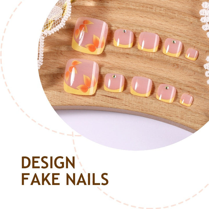 Artificial nail set with floral design and glitter accents Stornfield