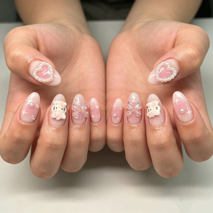 Playful artificial nails with heart and kitty motifs Stornfield