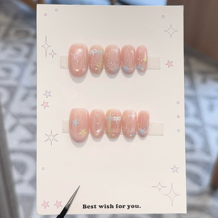 Artificial nails with romantic star and glitter motifs Stornfield