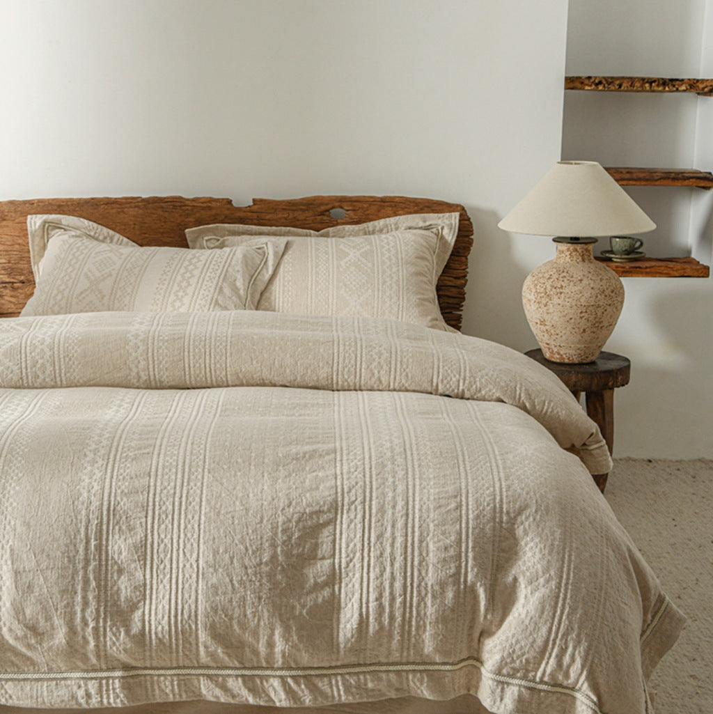 Vintage-inspired linen bedding set with subtle floral damask & ruffle