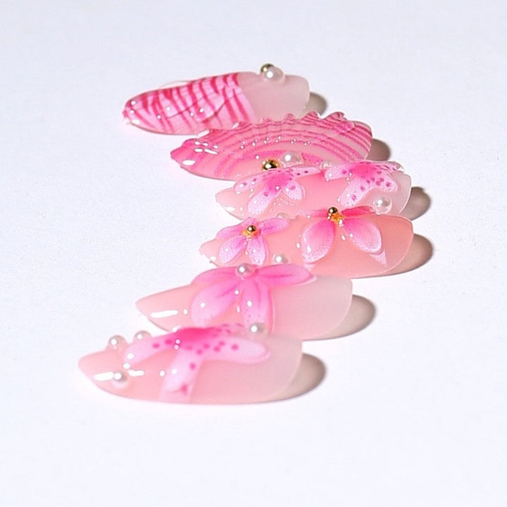 Artificial nail set with intricate 3D flowers and elegant accents Stornfield