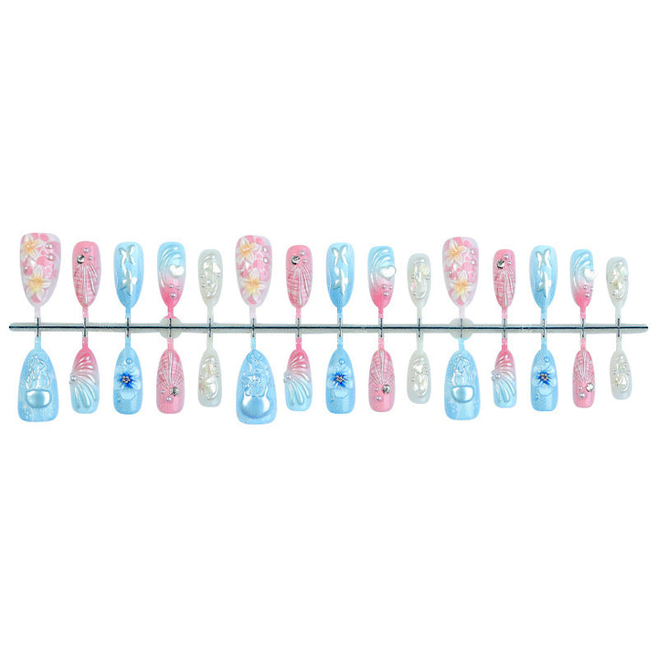 Artificial nail set with creative floral and glittering accents Stornfield