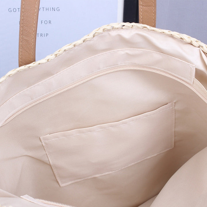Handwoven beach bag made of natural materials with leather accents Stornfield