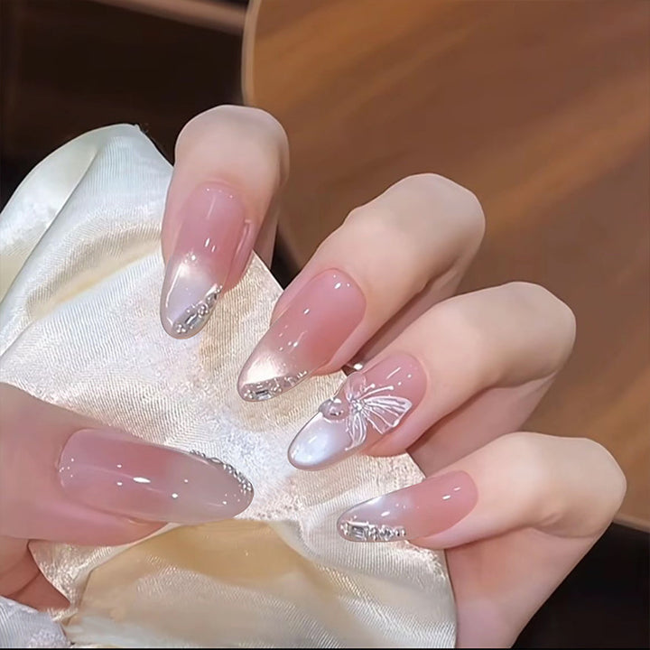 Artificial nail set with festive gift design and elegant glitter accents Stornfield