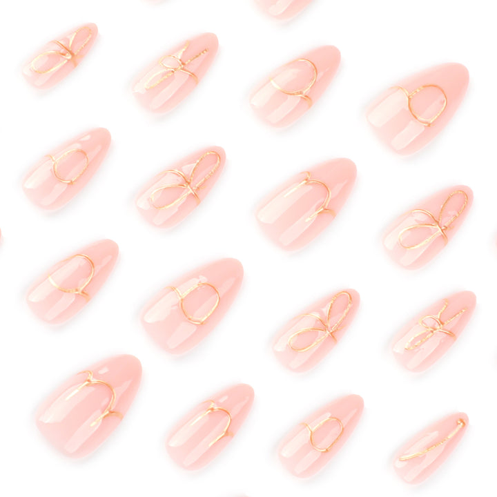 Creative nail art with golden accents and trendy lettering Stornfield