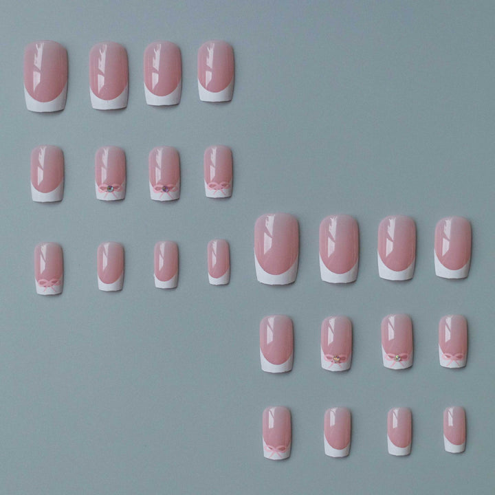 Elegant French Tip Nail Art Set with Delicate Bow Accents