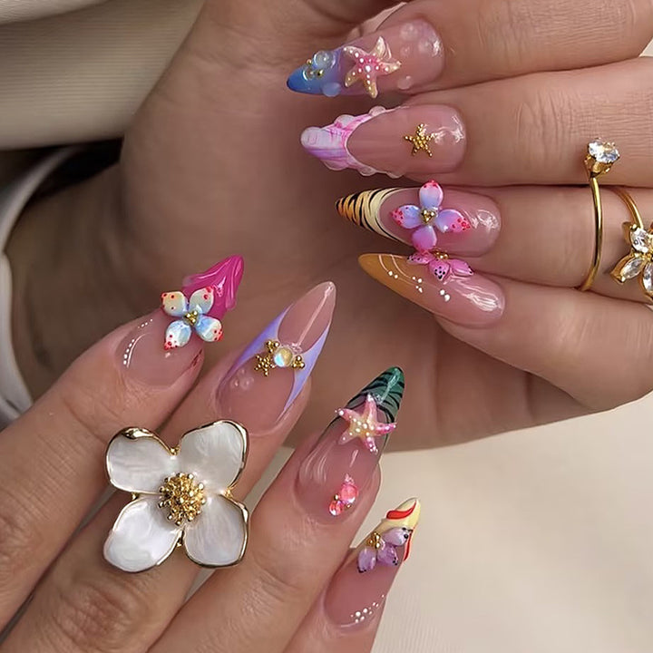 Creative nail art set with luxurious floral and glitter accents Stornfield