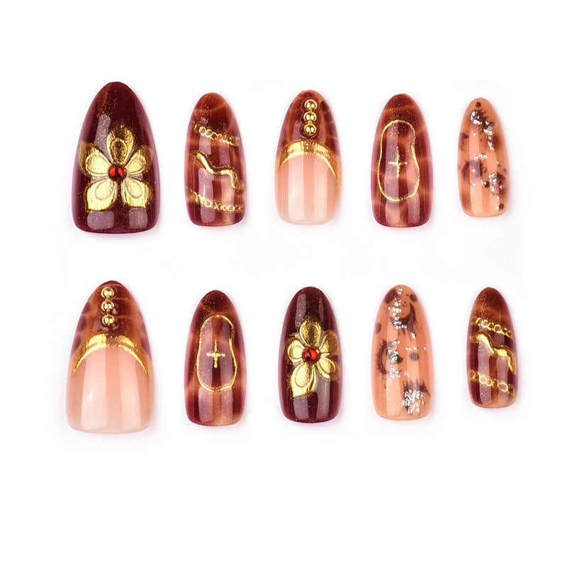 Deluxe artificial nails with golden accents Stornfield