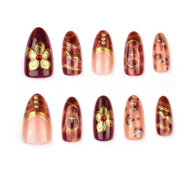 Deluxe artificial nails with golden accents Stornfield