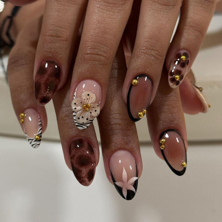 Nail Art with elegant flower design and glitter accents Stornfield
