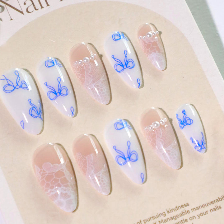 Artistic stiletto nails with delicate bow decorations Stornfield