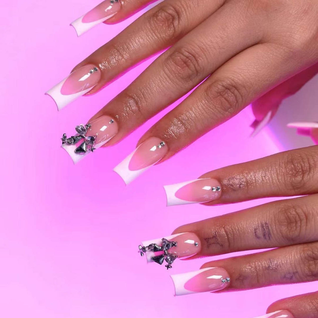 Artificial nail set with luxurious French tips and elegant embellishments Stornfield