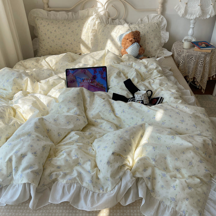 Romantic cotton satin bedding set with ruffled frills and fine floral pattern