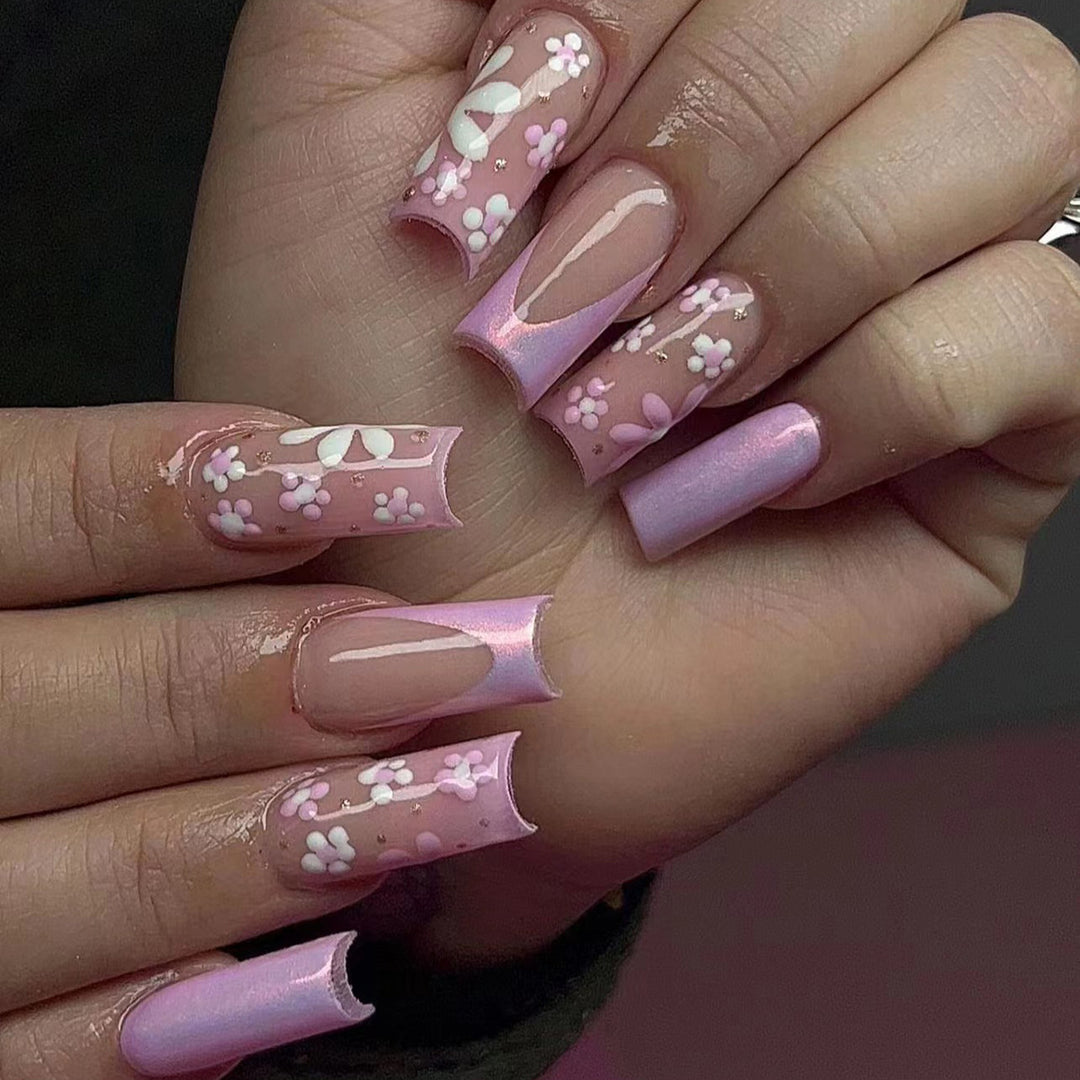 Artificial nail art with floral patterns and shine Stornfield