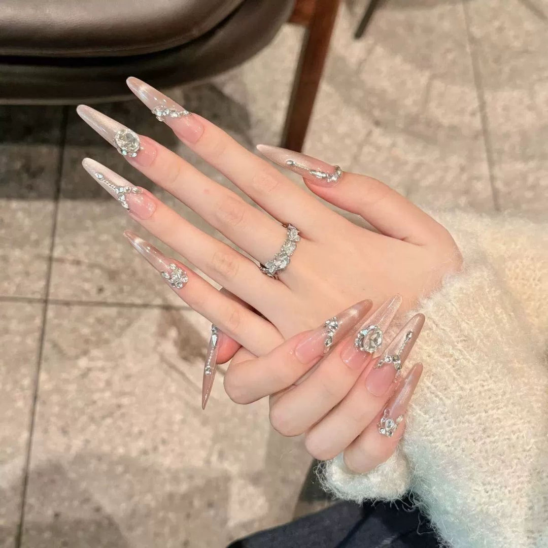 Glamorous artificial nail tips with elegant decorations Stornfield