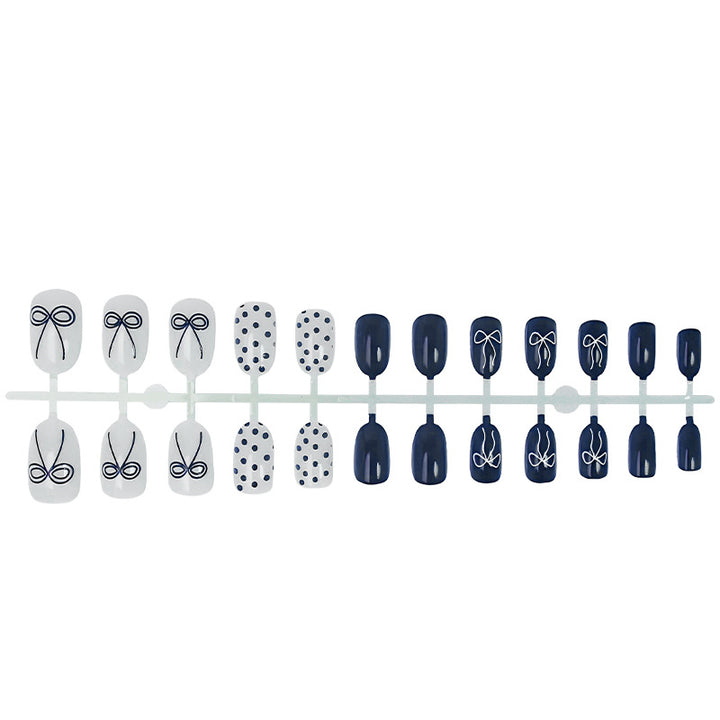 Nail set with stylish bows and dots Stornfield