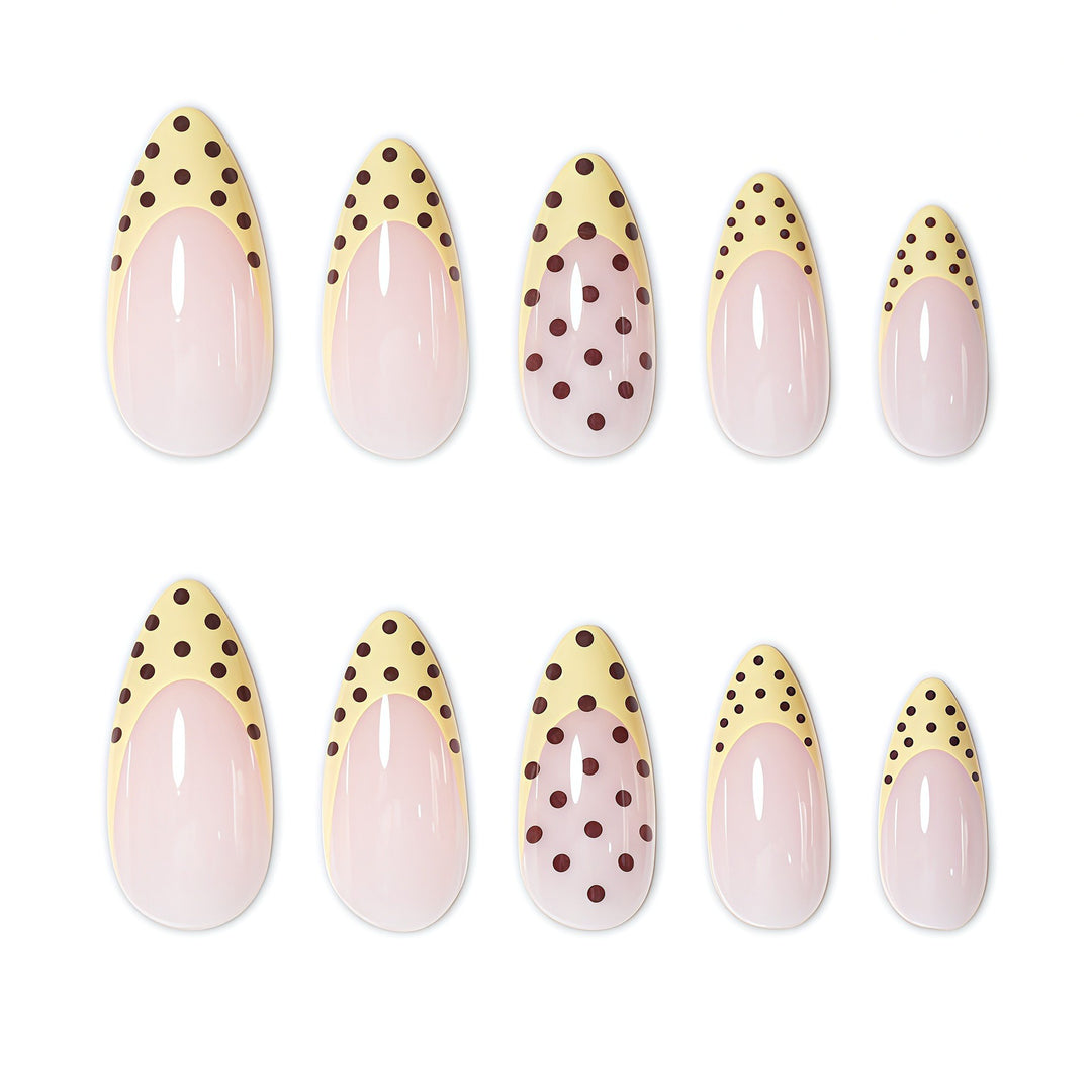 Elegant French Tip Nail Enhancements with Polka Dot Design Stornfield
