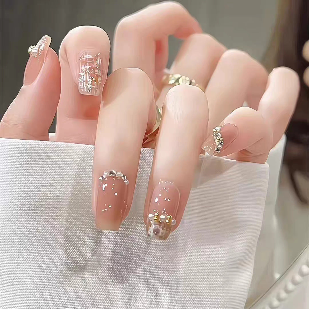 Artificial nails with elegant pearl and glitter decorations Stornfield