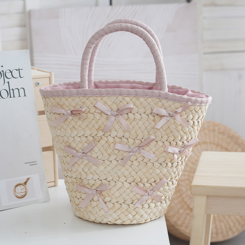 Basket bag with delicate bows and padded edge Stornfield