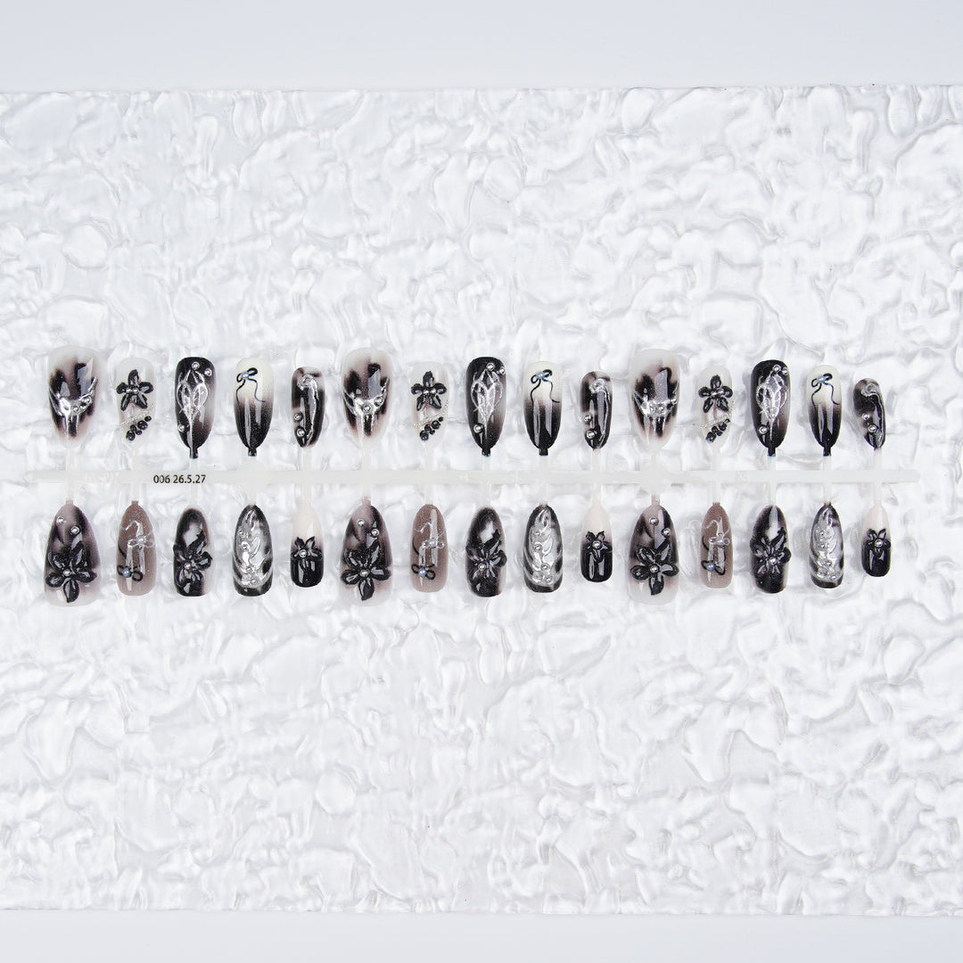 Elegant acrylic nail set with complex designs Stornfield