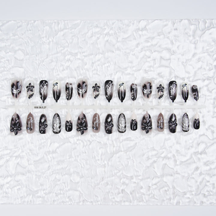Elegant acrylic nail set with complex designs Stornfield