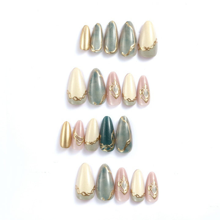 Artificial nails with elegant golden accents Stornfield