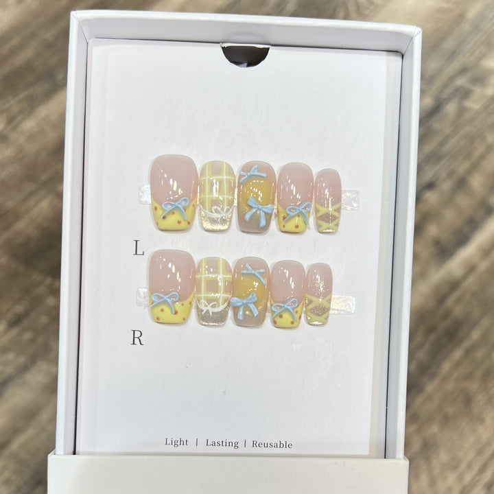 Decorative Press-On Nail Art Set with Charming Bow and Pattern Designs Stornfield