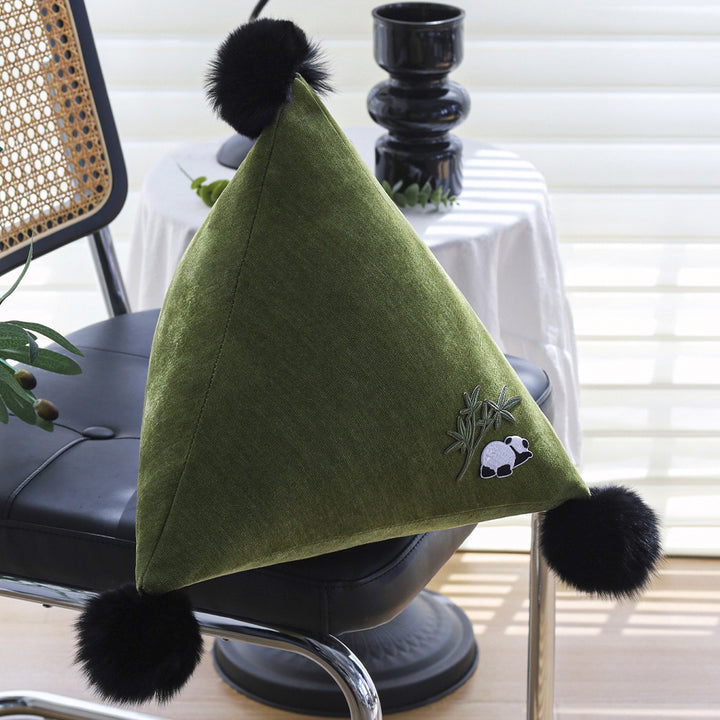 Decorative pillow in pyramid shape with animal design