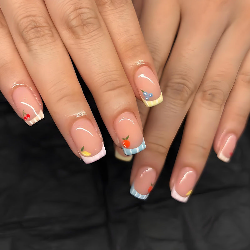 Nail art set with cheerful fruit designs and colorful accents Stornfield