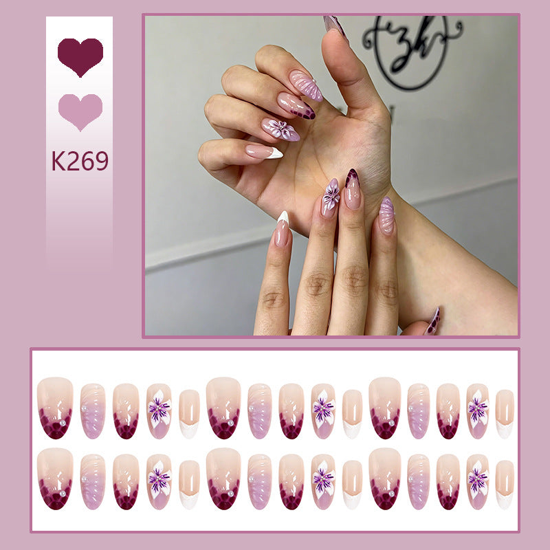 Artificial nails with elegant ombre effects and floral accents Stornfield