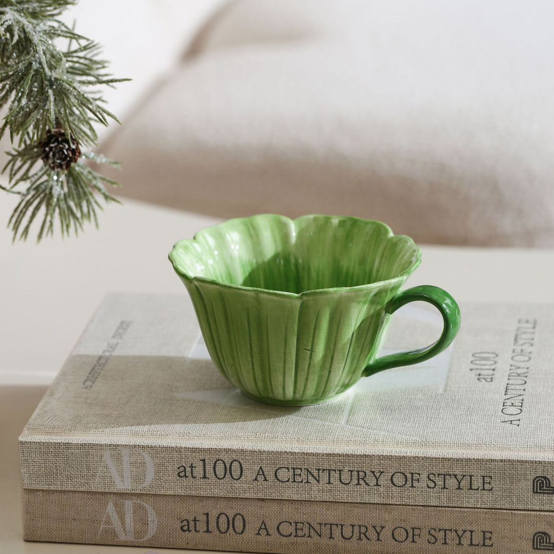 Ceramic mug with saucer in flower shape
