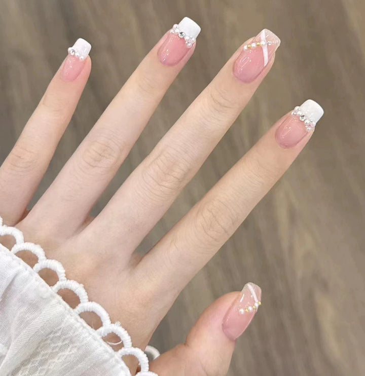Elegant nail design with pearl embellishment Stornfield