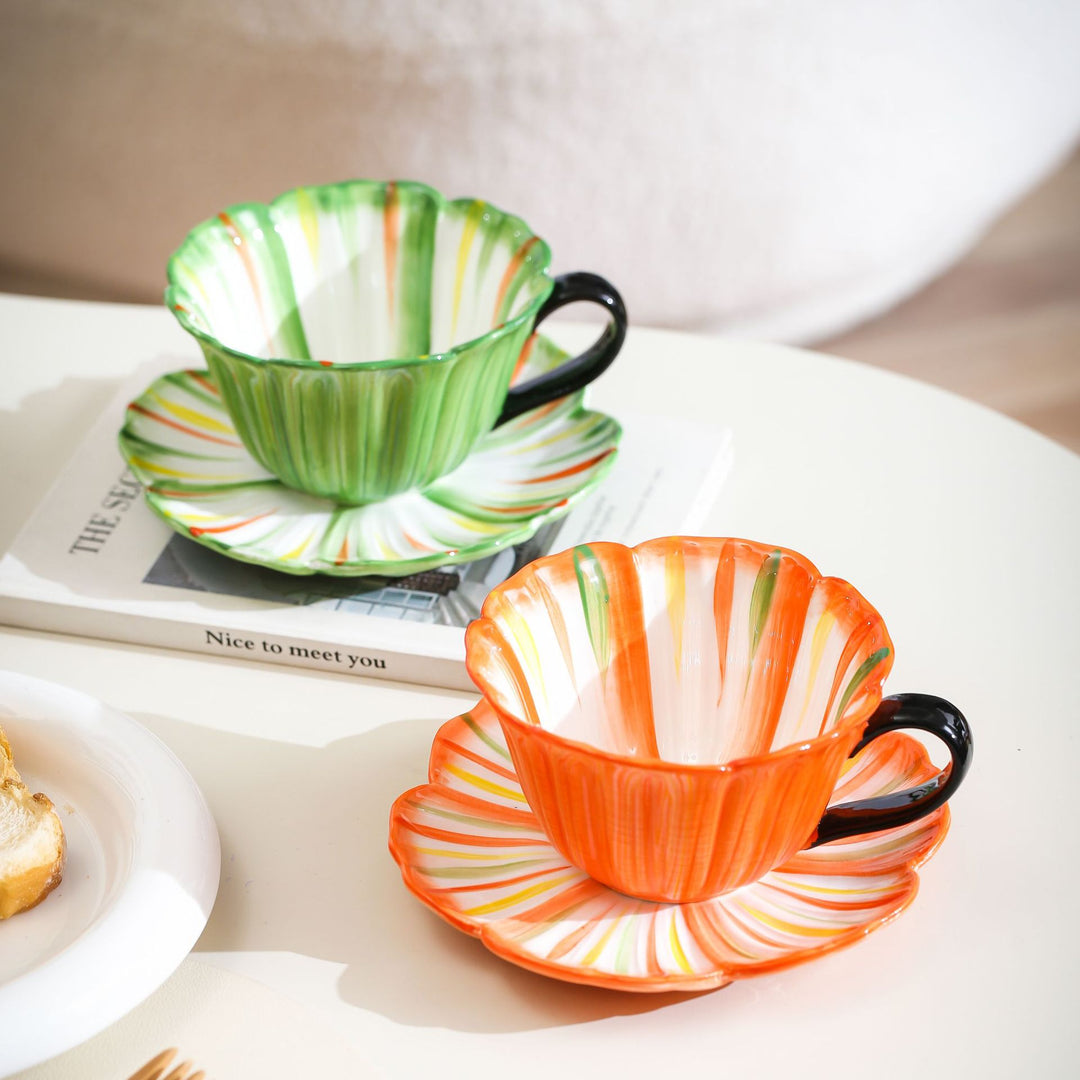 Handcrafted ceramic mug with shell-shaped wave edge and contrasting handle