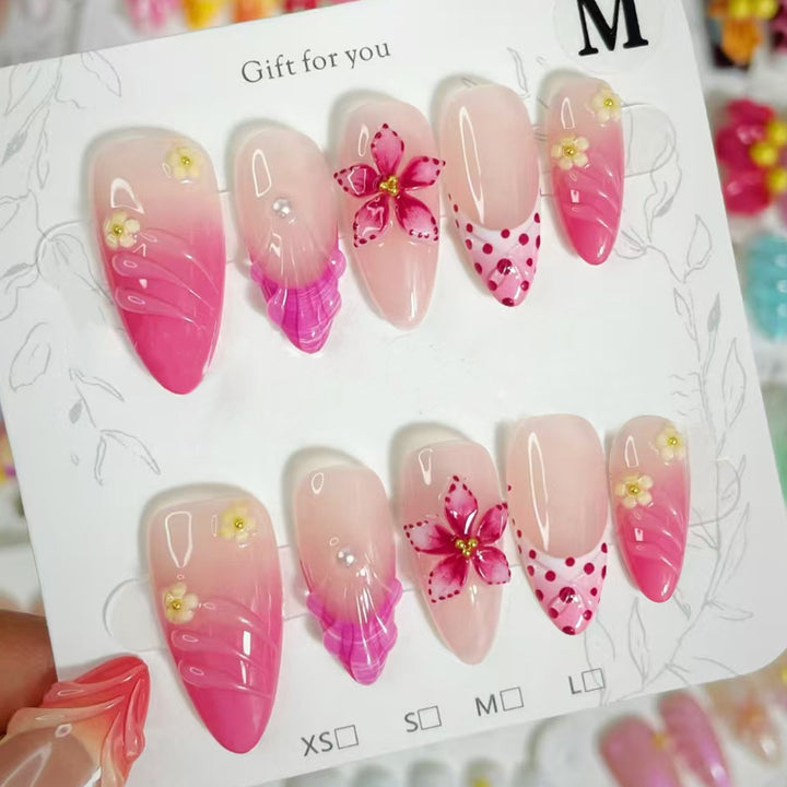 Artful nail tips with delicate floral embellishments Stornfield