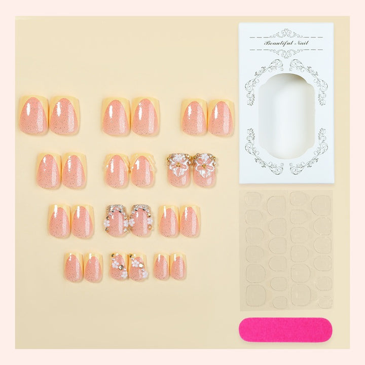 Artificial nail set with floral design and glamorous embellishments Stornfield