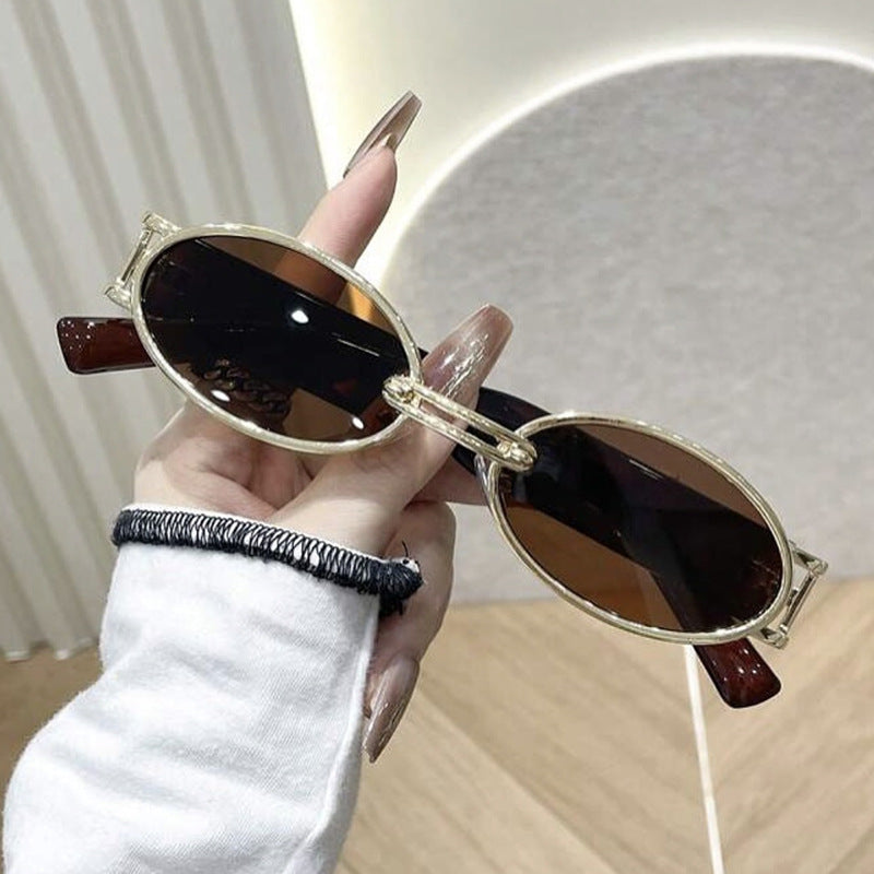 Women oval-shaped sunglasses with golden accents and stylish frame Stornfield
