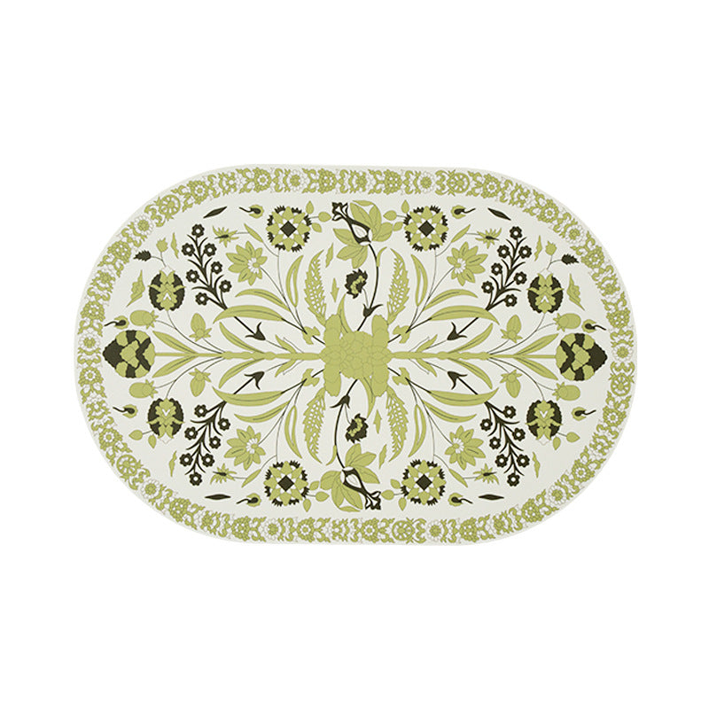 Oval table mat made of wipeable cotton-linen mix with intricate floral print
