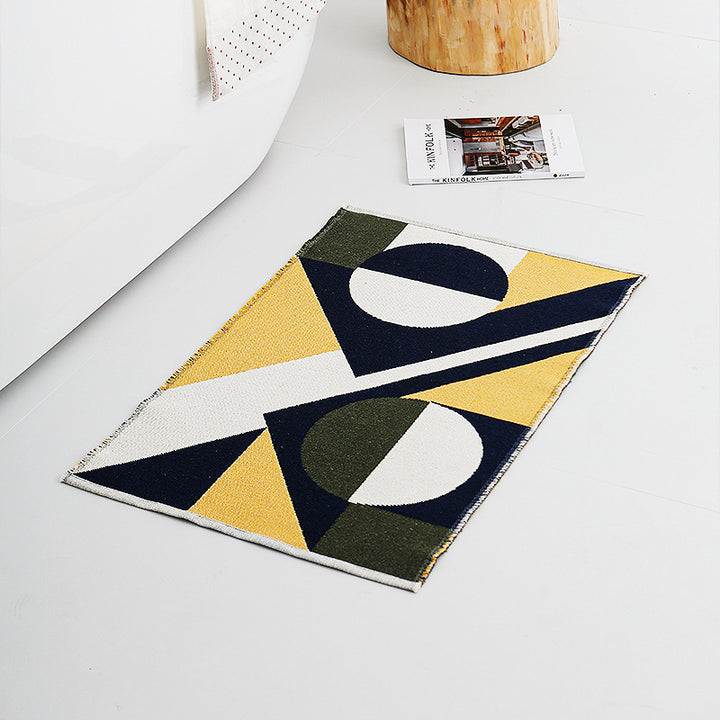 Flat-woven living room rug in a graphic tile pattern