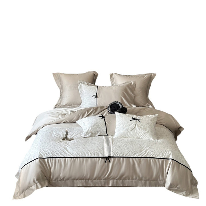 Reversible Duvet Cover Bedding Set with Quilted Jacquard Panel, Black Piped Trim & Decorative Bow Shams