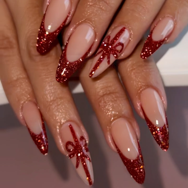 Nail set with glamorous glitter accents and bow design Stornfield