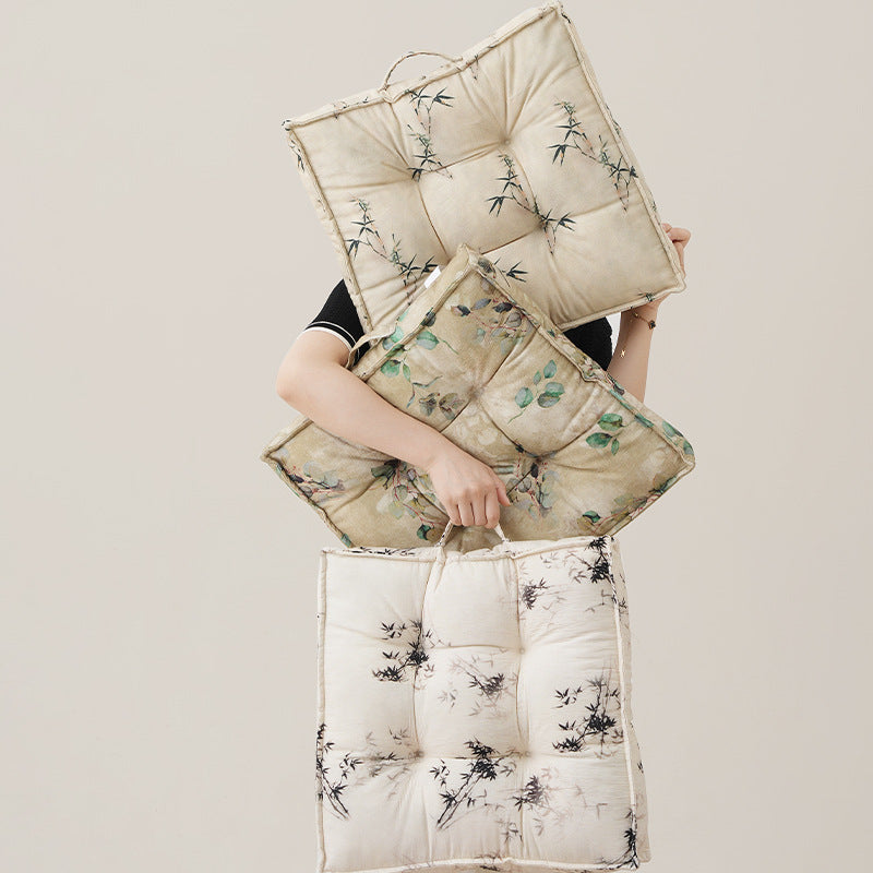 Padded seat cushion with tufting and bamboo motif