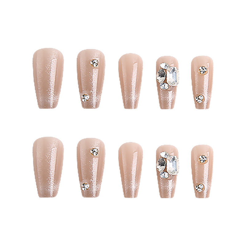 Acrylic nail set with glamorous glitter accents and elegant jewelry embellishments Stornfield