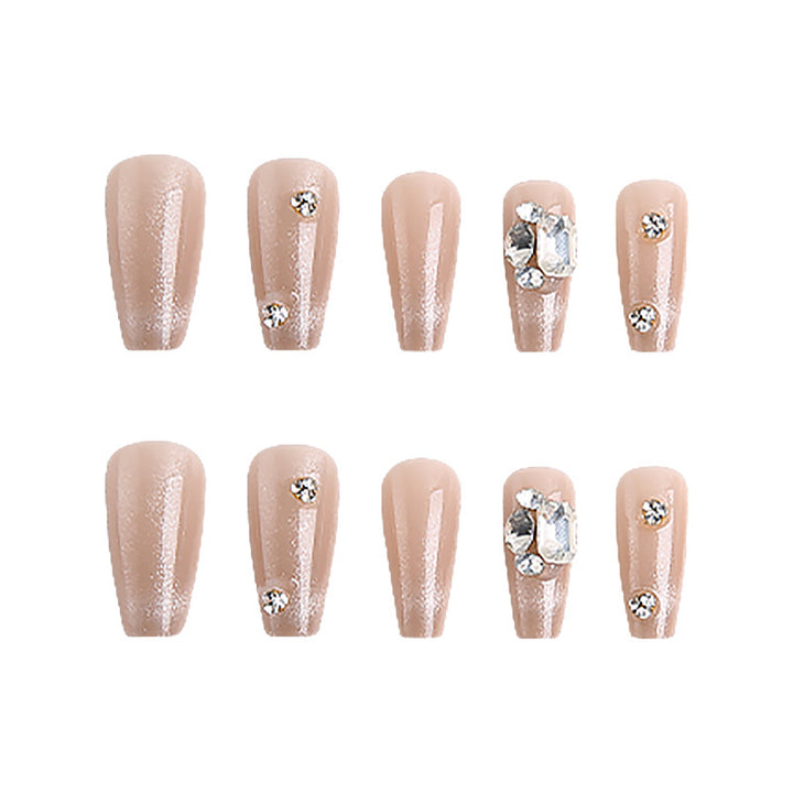 Acrylic nail set with glamorous glitter accents and elegant jewelry embellishments Stornfield