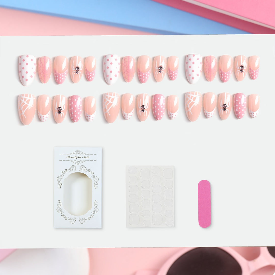 Artificial nail set with playful spider and polka dot motifs Stornfield