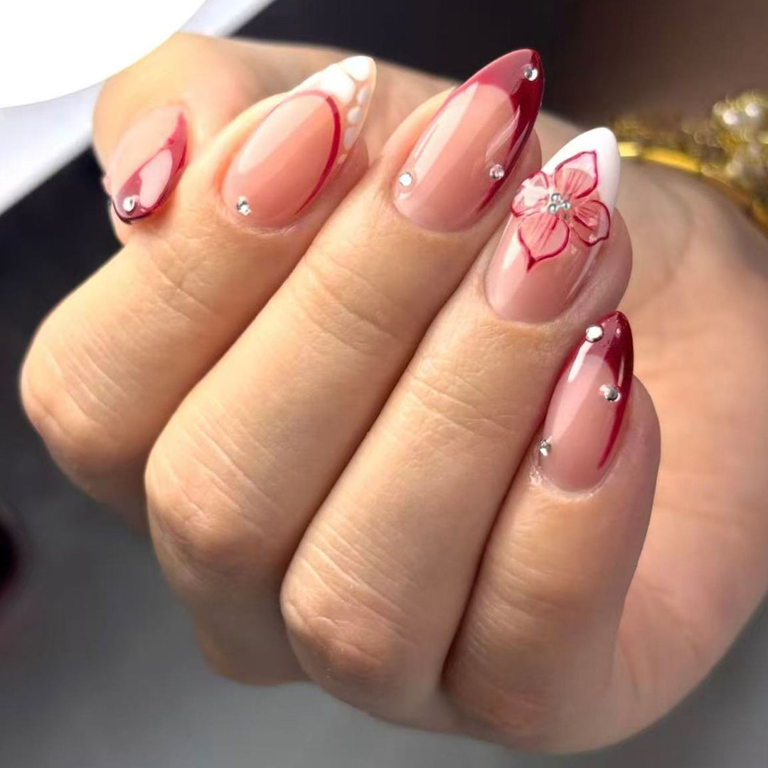 Artificial nails with floral and glittering accents Stornfield