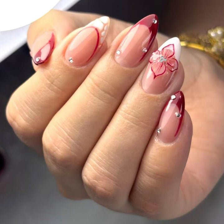 Artificial nails with floral and glittering accents Stornfield