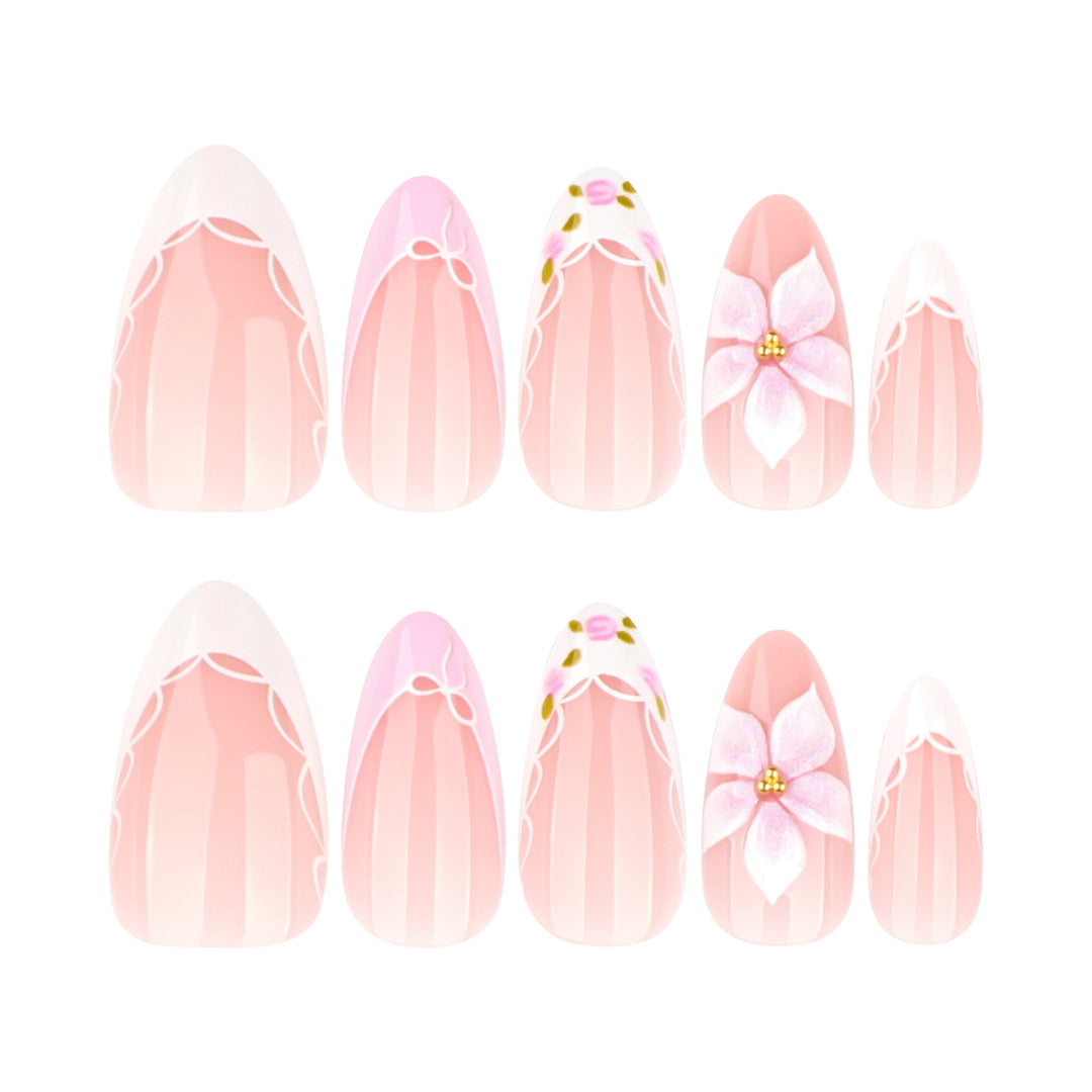 Artful nail extensions with delicate floral pattern and elegant accents Stornfield